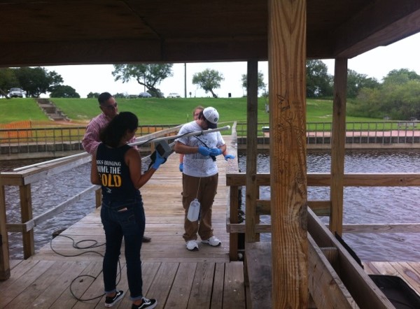 Environmental Engineering Students Collecting Samples at a Dock Picture3