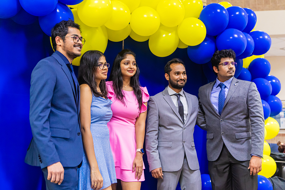 Students gather for a group photo at the Frank H. Dotterweich College of Engineering.