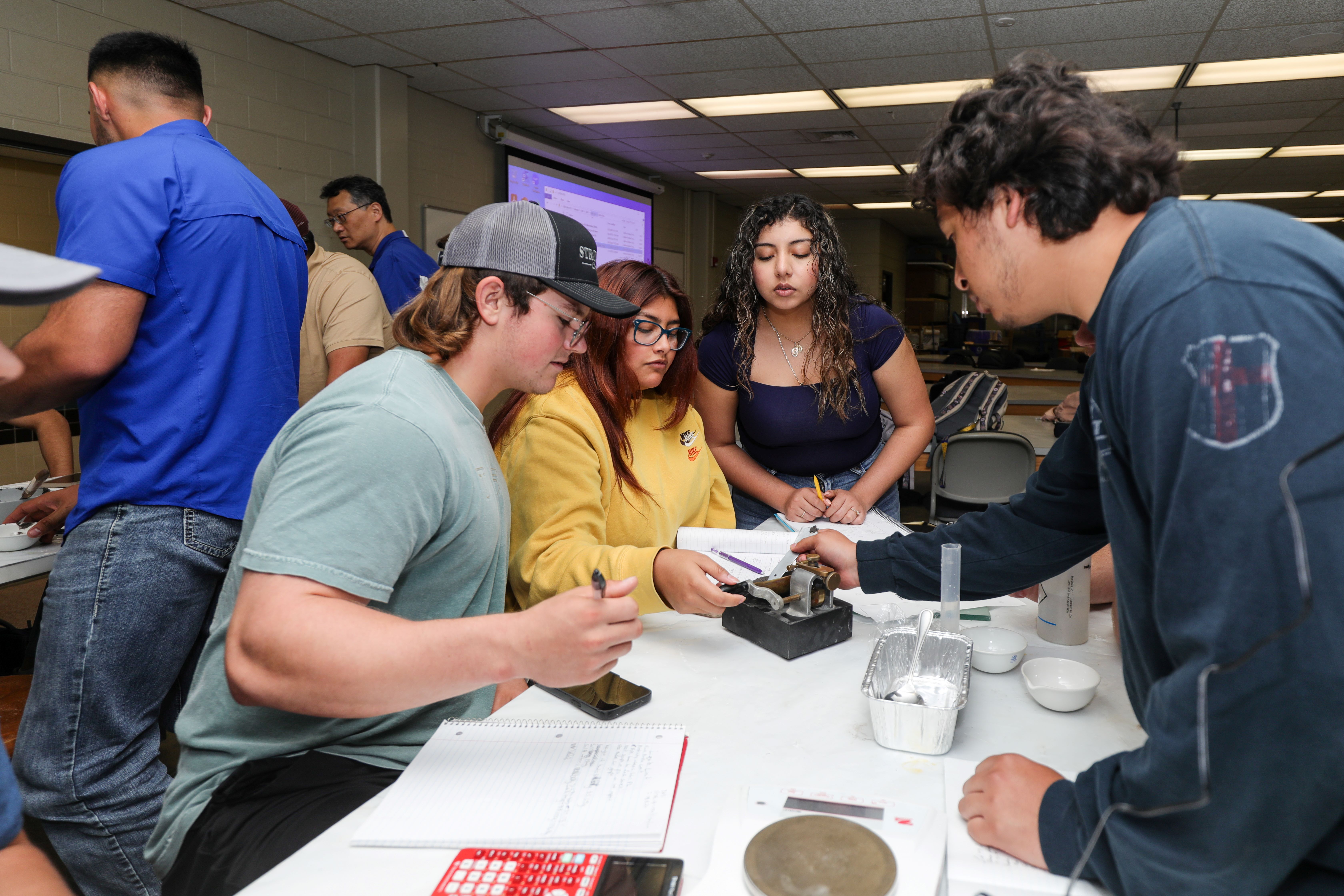 Students performing a liquid limit test