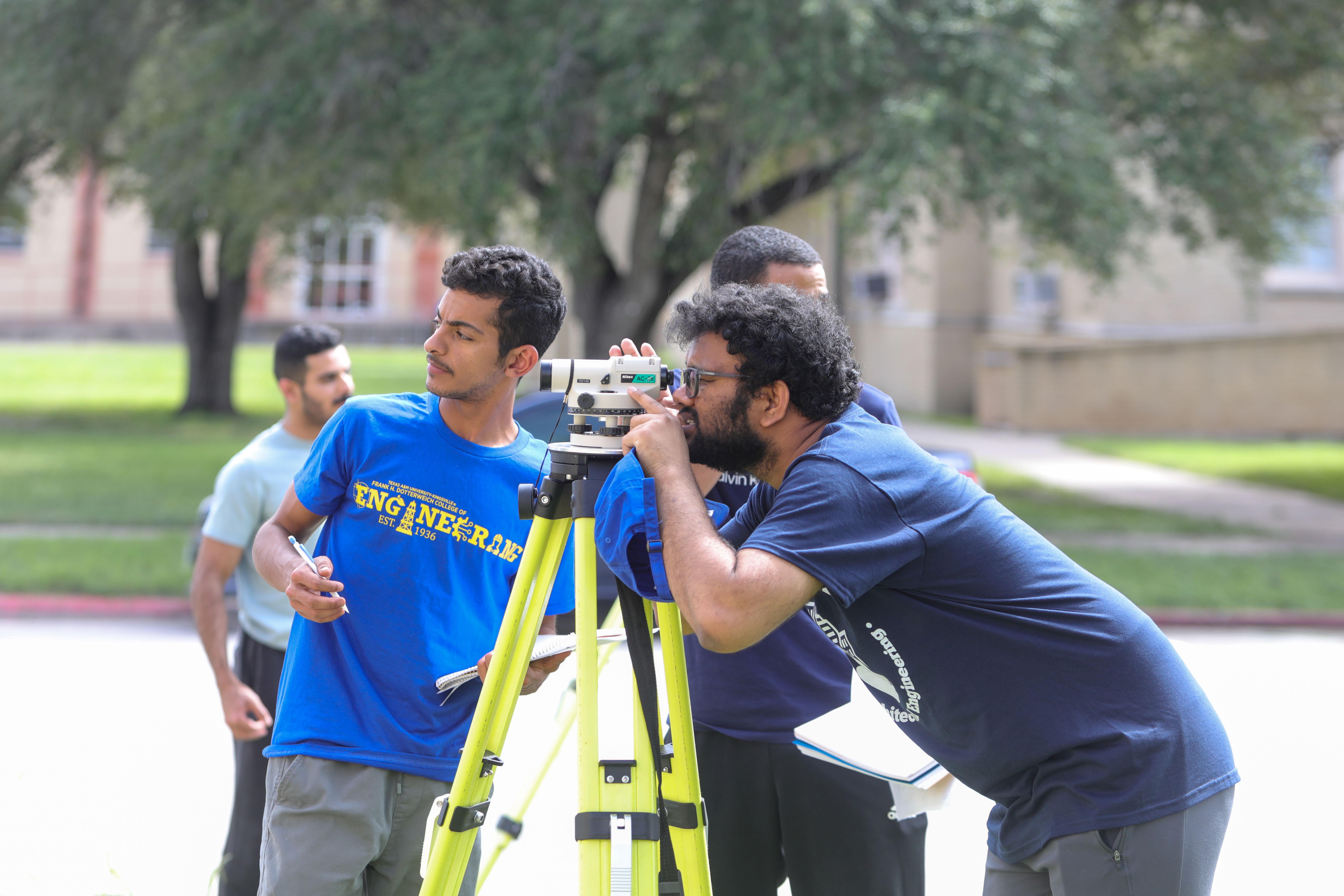 Graduate TA helping in surveying lab