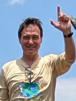 Eduardo Garza holding up the j-sign