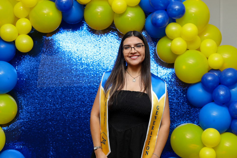 First-generation female student with her first-gen stole